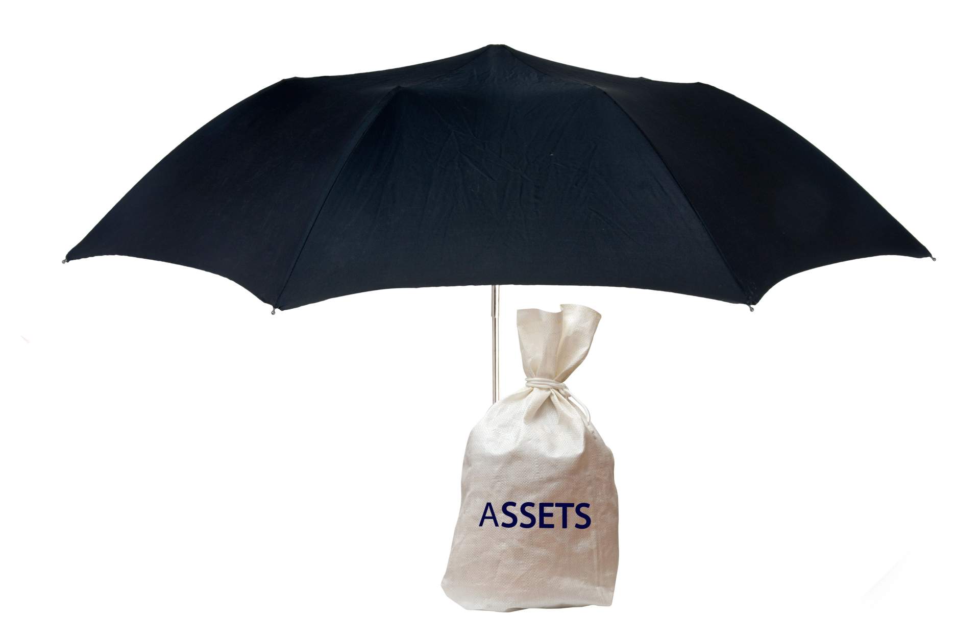 A sack with 'assets' written on it sitting under an umbrella